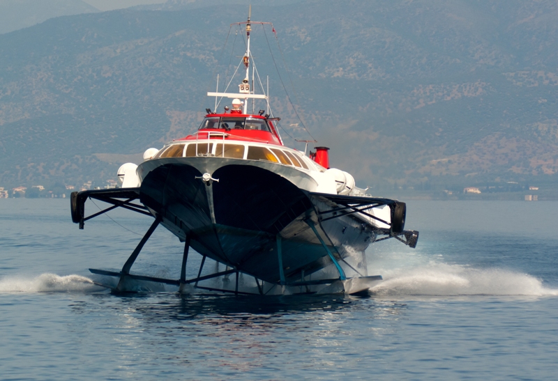 A Hydrofoil Approaching The Port Of The Greek Island Hydra