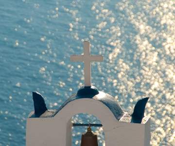 Greek Church In Santorini Greece With A Cross